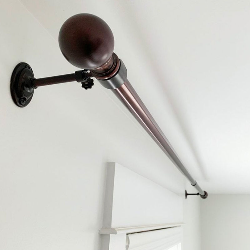 Curtain rod installation with proper anchoring for long-lasting support.